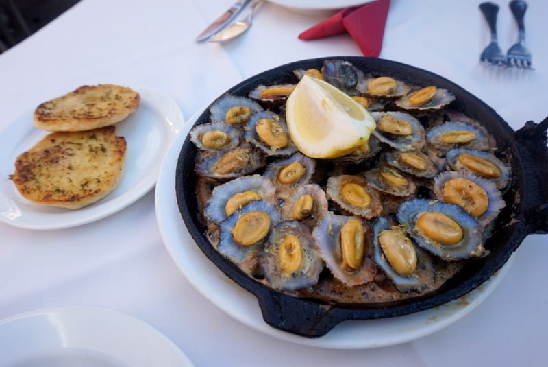 Lapas - Limpets: fried and served on a frying pan with garlic and butter; typical dish from Madeira